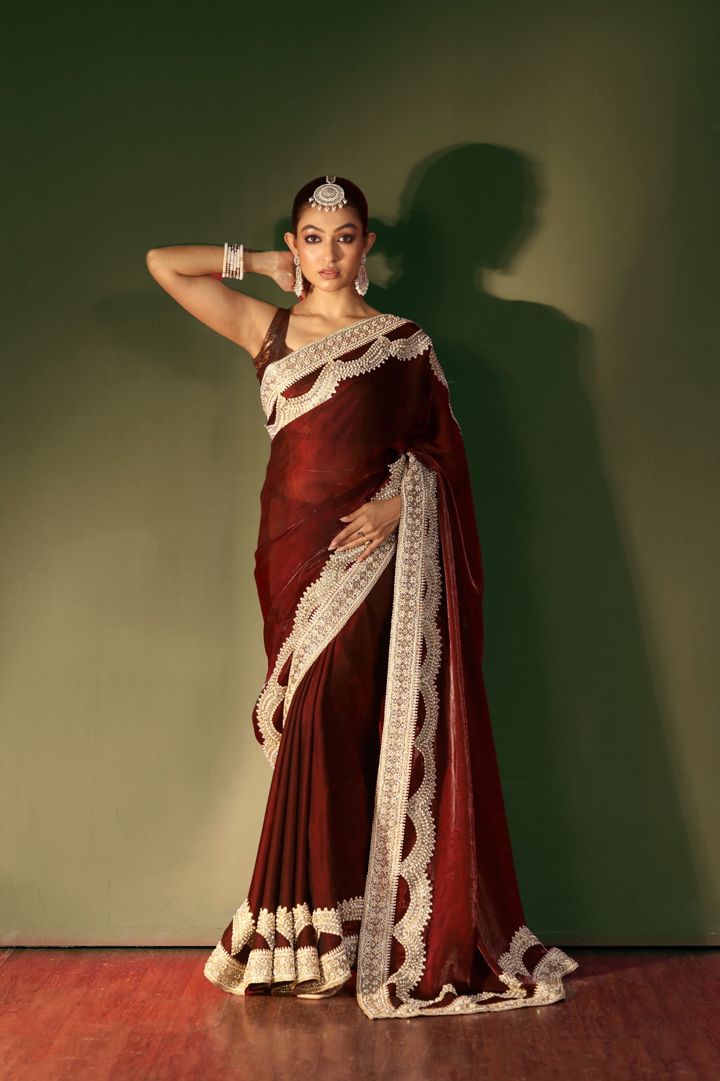 Regal Maroon Velvet Saree with Intricate Handcrafted Zari Embroidery