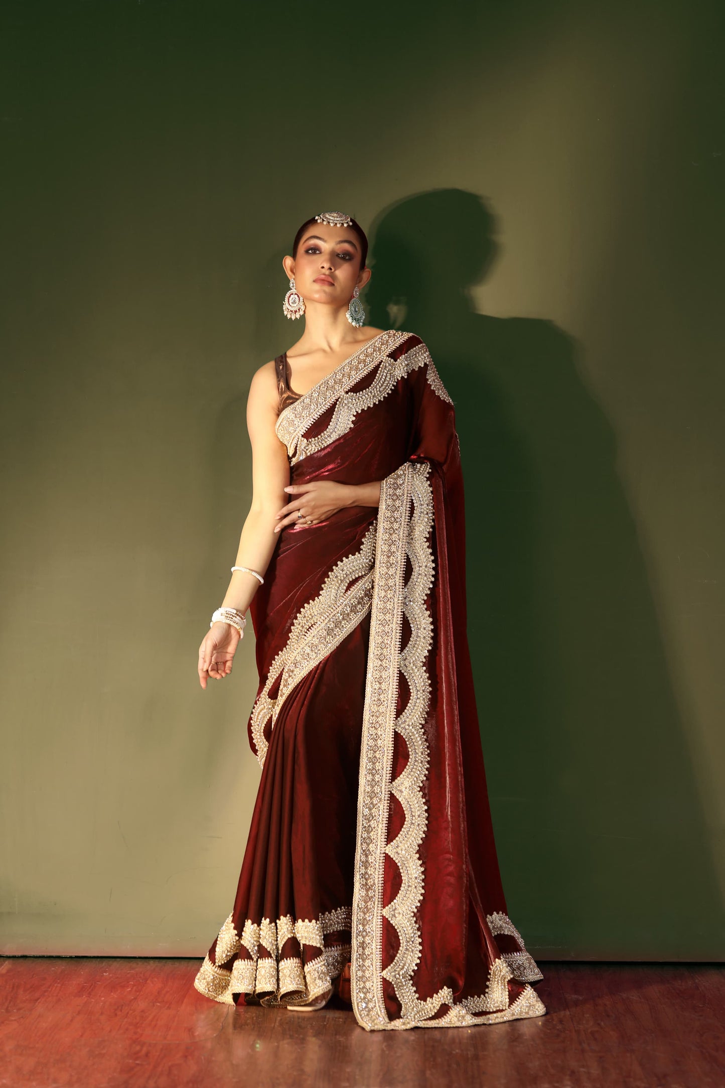 Regal Maroon Velvet Saree with Intricate Handcrafted Zari Embroidery